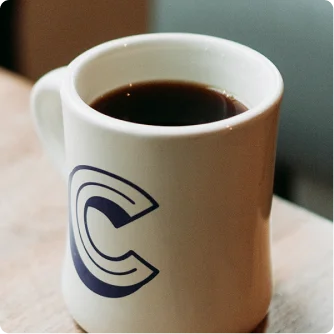 Coffee mug with a logo printed on it
